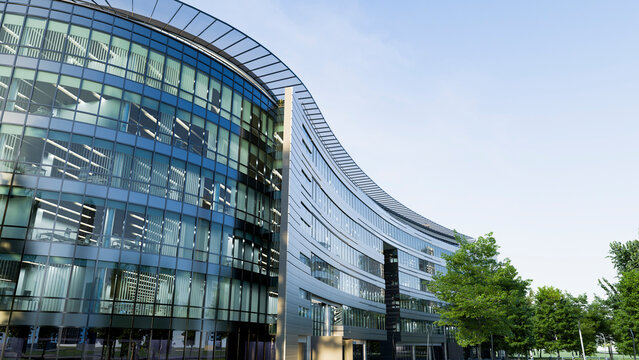Modern office building with curved glass facade and outdoor greenery