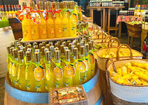  Palermo, Italy, June 12, 2026. A beautiful display of authentic Sicilian fruit cream liqueurs and traditional yellow limoncello bottles on shelves inside a popular souvenir shop in Palermo, Italy. Pe