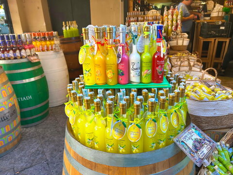  Palermo, Italy, June 12, 2026. A beautiful display of authentic Sicilian fruit cream liqueurs and traditional yellow limoncello bottles on shelves inside a popular souvenir shop in Palermo, Italy. Pe