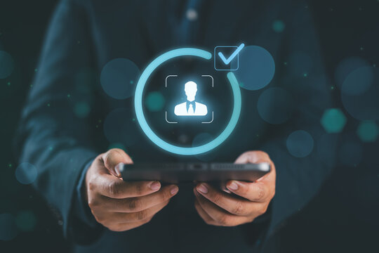 Know your customer (KYC) concept. Businessman holding identity verification symbol for Increase financial security and access personal financial data. Biometrics security.