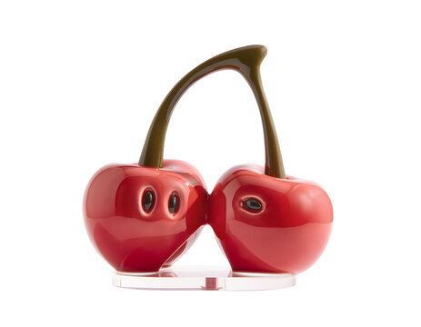 Glossy red ceramic cherry fruit figurine sculpture with brown stems isolated on transparent background charming featuring connected cute facial details versatile design use element