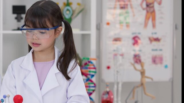 Elementary Student in Lab Coat Working on Solar System Project