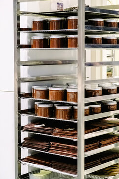 Rack in industrial kitchen with food containers