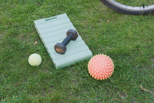 Selection of sports equipment on grass