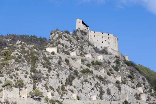 The Citadelle d Entrevaux sits atop a rocky hill with fortified walls and zigzag ramps.