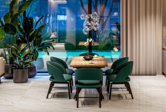 3D render of a luxury open-concept interior featuring a modern living room, dining area, floating staircase, marble accents, and panoramic windows with a pool view