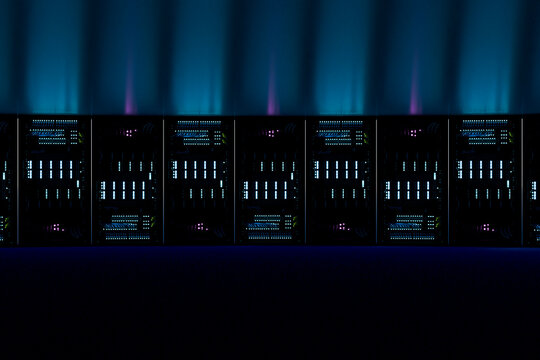3D server rack array with cyan data light in dark cloud center