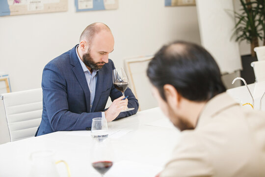 Sommelier Tasting Red Wine in Winemaking Courses. Winery Connoisseur is Training. 
