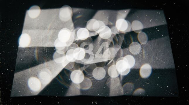 Abstract blurred background with number 84 and bokeh effect