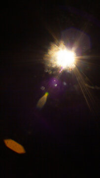 Sun flare on the black background
