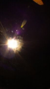 Sun flare on the black background