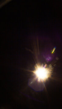 Sun flare on the black background