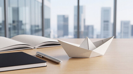 Fototapeta premium White origami paper boat on wooden office desk with notebooks and pen, blurred city skyscrapers background, conceptual image for business leadership, creative vision, and career ambition.