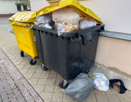 recycling bin with plastic garbage in the city