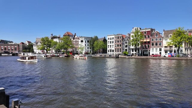 River Amstel with House Boats in Amsterdam, Netherlands	
