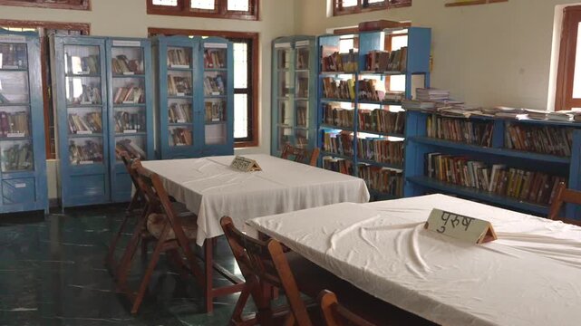 Library Reading Room with Bookshelves and Hindi Sign &ldquo;Purush&rdquo;/ "men" on Table, India