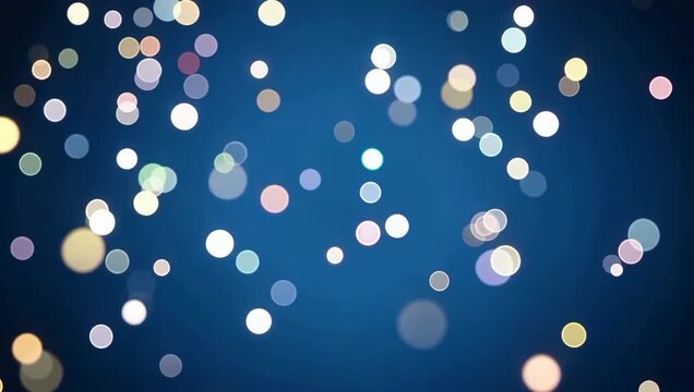 Dreamy winter blue background with soft blurred falling snowflakes and glowing bokeh circles.