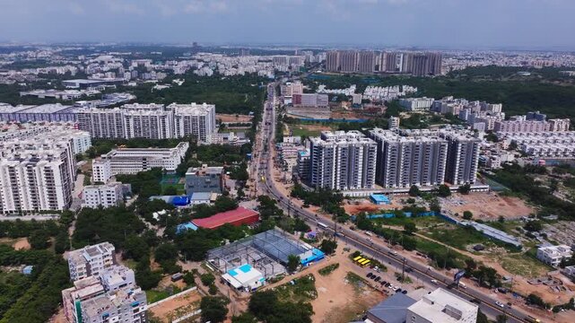 Wide view of Keshava Reddy School with Gothic Pentagon Clouds and Praneeth Pranav Solitaire apartments at bachupally, hyderabad, telangana, india. day time, push in shot, drone shot, 4k.