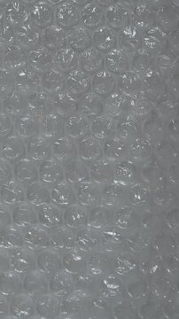 Abstract stop motion bubble wrap plastic texture background with light reflection, handmade creative pattern concept
