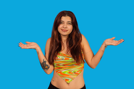 Woman shrugging hands expressing confusion and uncertainty