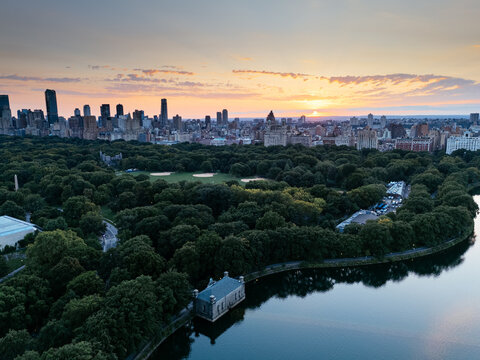Aerial view of Central Park surrounded by Manhattan skyscrapers and New York City skyline.