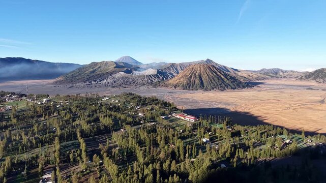 Breathtaking volcanic ridges rise majestically against a cloudless azure sky