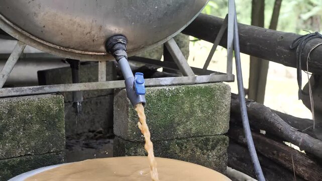 Contaminated dirty tap water flowing dark sediments 
Contaminated, murky, and polluted domestic water