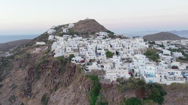 Plaka Village with White Houses and Hilltop Church in Milos Greece