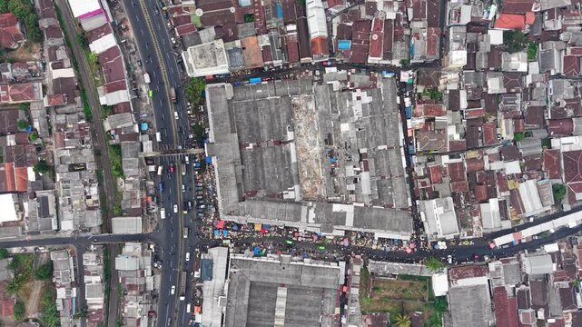 Urban sprawl thrives near busy roads. Concrete and rooftops at Lawang