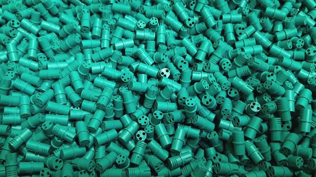 Smooth camera movement over industrial plastic parts texture. Abstract background of manufactured polymer components, mass production, injection molding elements and technical industry concept.