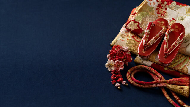 Kanzashi hair ornament and red zori for Japanese shichigosan on indigo