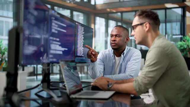 Software Developers Collaborate On Coding Project
