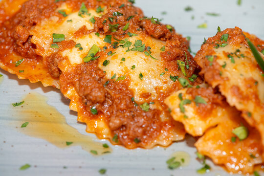 Delicious ravioli served in Italian restaurant with sauce and fresh ingredients