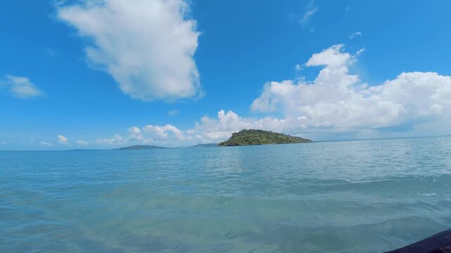 Scenic tropical island across bright blue sea