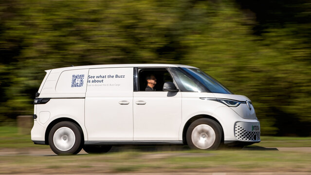 Milton Keynes; UK - Sept. 18th 2026: 2022 white Volkswagen ID Buzz electric van driving on a British road