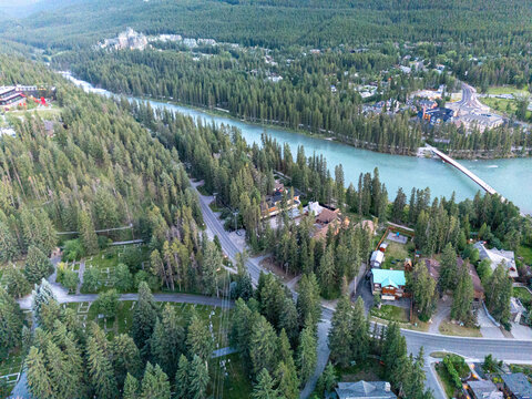 High altitude drone capture of Banff landscape under clear blue summer sky