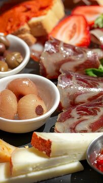 Traditional Italian antipasti platter featuring toasted bread toppings in rustic trattoria setting