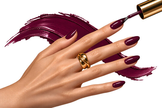 Manicured female hand holding an object isolated on white background with elegant red nails and modern beauty styling.