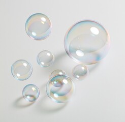 Obraz premium Colorful iridescent soap bubbles floating on white background