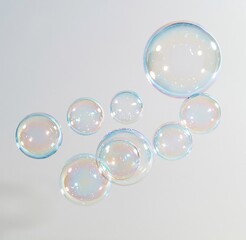 Obraz premium Colorful soap bubbles floating against white background