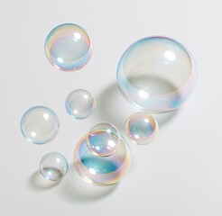 Obraz premium Colorful soap bubbles floating on white background