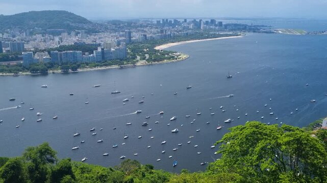 Breathtaking Rio de Janeiro panorama from Sugarloaf Mountain overlooking Guanabara Bay, Flamengo Beach, Urca, city skyline, boats, and Santos Dumont Airport