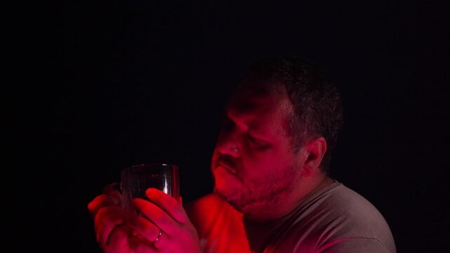 Sad  man lonely in pub drinking beer.