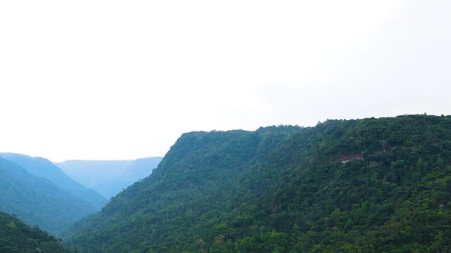 Tropical Forest Covers The Meghalaya Hill Range At Dawn With Layered Green Hills And Dense Woodland. Aerial Shot