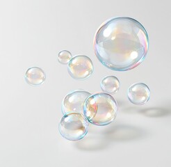 Obraz premium Colorful soap bubbles floating against a white background