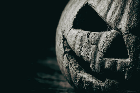 Carved jack-o'-lantern pumpkin in the dark