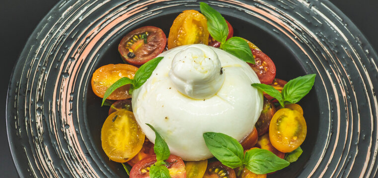 Burrata cheese with tomatoes and basil