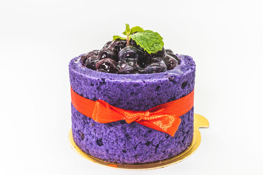 Purple berry mousse cake with fresh blueberries