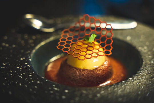 Gourmet dessert with honeycomb and caramel sauce