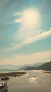 beautiful landscape of Lake Skadar on Balkan Peninsula, spanning Montenegro, Albania. green plants leaves specifically water caltrop, Trapa natans, float cover water surface. sunset sky mountains